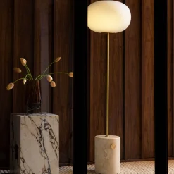 JWDA floor | Red travertine stone and bronzed brass